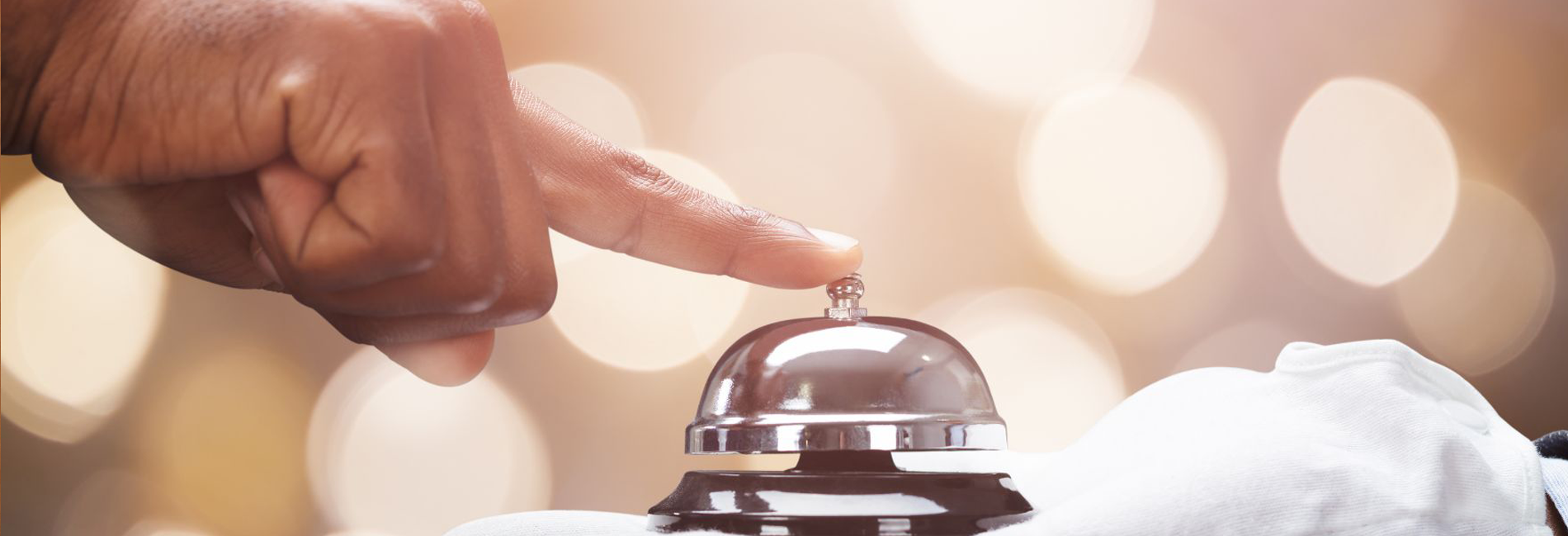 Hand ringing bell at front desk