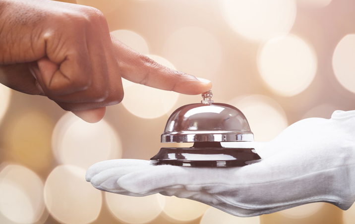 Guest ringing front desk bell