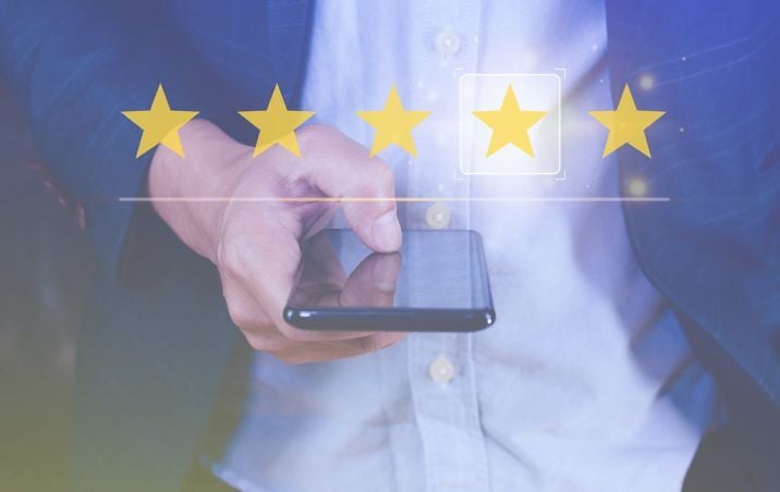 hand-holding-phone-review_716