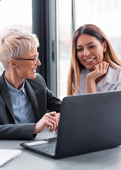 2 business women smiling